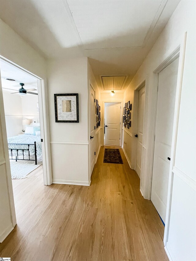 409 Freeman Bridge Rd, Marietta, SC 29661 - corridor with light wood-type flooring, attic access, and baseboards