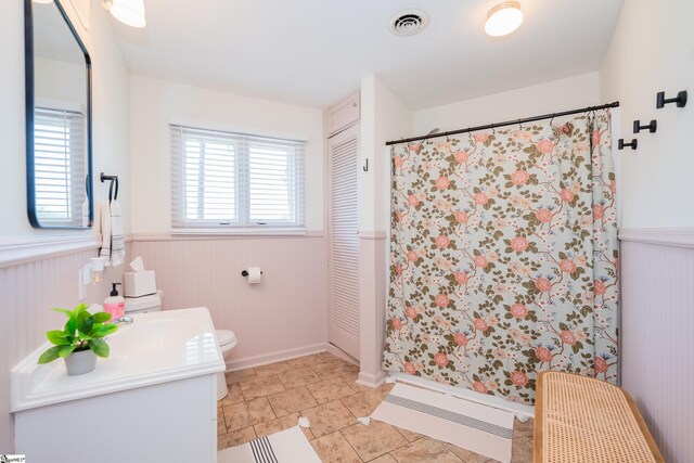 409 Freeman Bridge Rd, Marietta, SC 29661 - bathroom with a wainscoted wall, vanity, toilet, and a shower with shower curtain