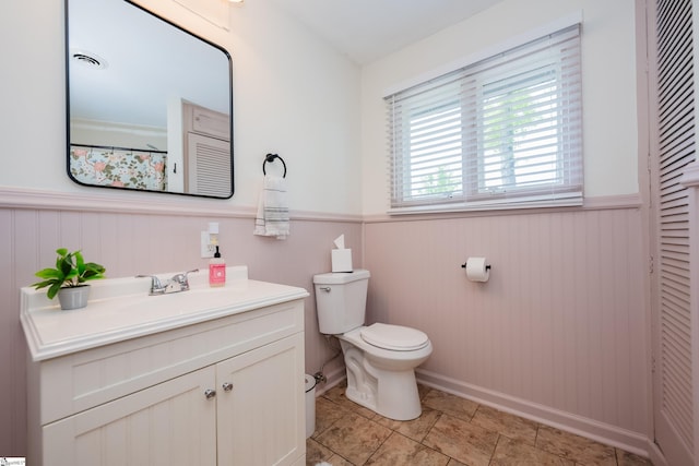 409 Freeman Bridge Rd, Marietta, SC 29661 - bathroom with a wainscoted wall, toilet, and vanity