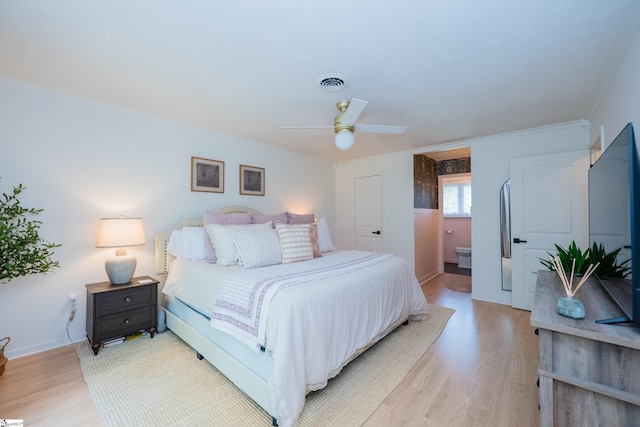 409 Freeman Bridge Rd, Marietta, SC 29661 - bedroom with light wood-type flooring, crown molding, a ceiling fan, baseboards, and ensuite bath