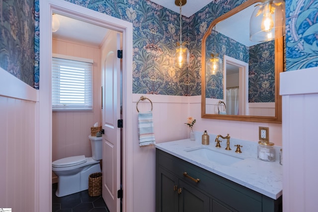 409 Freeman Bridge Rd, Marietta, SC 29661 - full bathroom featuring wallpapered walls, toilet, vanity, ornamental molding, and tile patterned floors