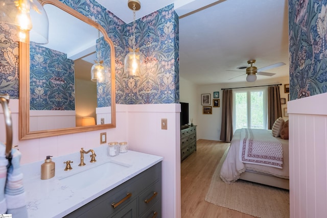 409 Freeman Bridge Rd, Marietta, SC 29661 - ensuite bathroom with wood finished floors, a ceiling fan, and vanity