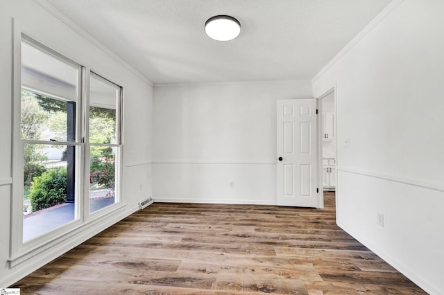 218 Spring View Ln, Taylors, SC 29687 - spare room with wood finished floors, visible vents, baseboards, and ornamental molding