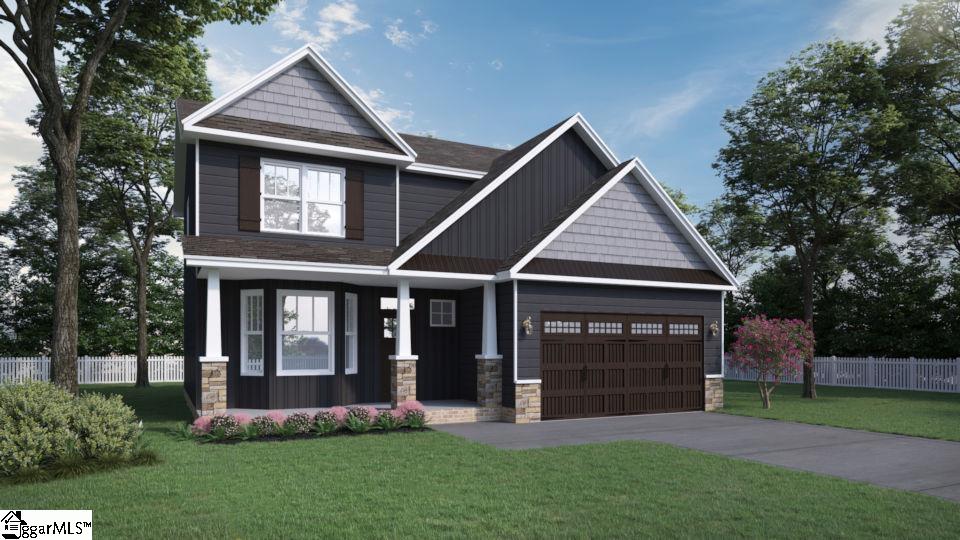 331 River Trace Loop, Simpsonville, SC 29680 - craftsman inspired home with an attached garage, driveway, fence, and stone siding