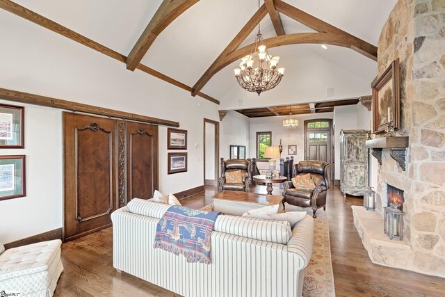 295 Chastain Hill Rd, Taylors, SC 29687 - living area with high vaulted ceiling, a stone fireplace, baseboards, a notable chandelier, and beam ceiling