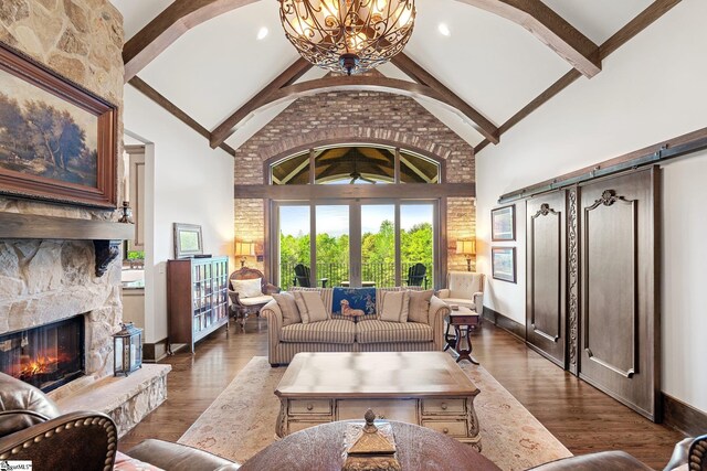 295 Chastain Hill Rd, Taylors, SC 29687 - living area with a stone fireplace, wood finished floors, beam ceiling, and high vaulted ceiling