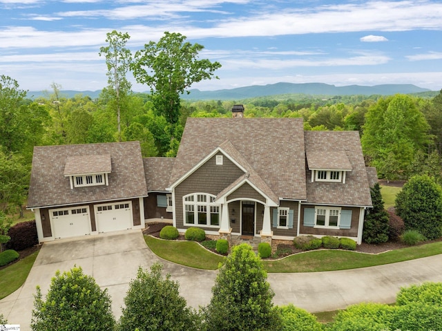 295 Chastain Hill Rd, Taylors, SC 29687 - view of front of house with concrete driveway, a mountain view, a chimney, and a garage