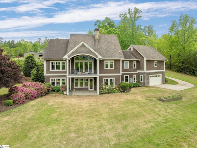 295 Chastain Hill Rd, Taylors, SC 29687 - rear view of property featuring driveway, a chimney, an attached garage, a balcony, and a yard