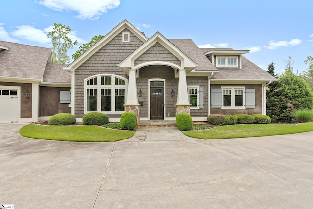 295 Chastain Hill Rd, Taylors, SC 29687 - craftsman-style house featuring concrete driveway, a porch, a shingled roof, and a garage