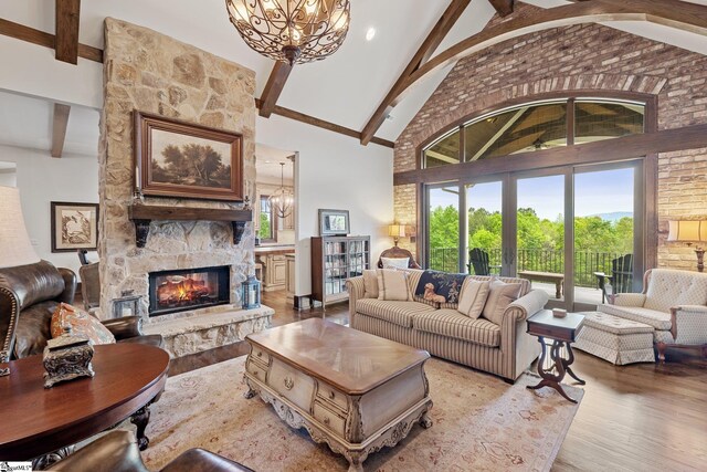 295 Chastain Hill Rd, Taylors, SC 29687 - living room with beamed ceiling, light wood-style flooring, high vaulted ceiling, and an inviting chandelier