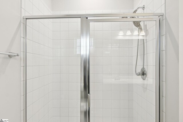 bathroom featuring a shower stall