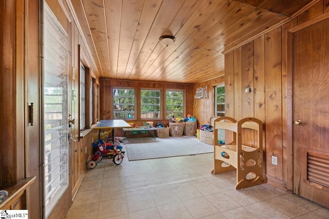 sunroom / solarium featuring a wall unit AC