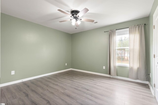 381 Deer Farm Pond Ln, Fair Play, SC 29643 - empty room with wood finished floors, baseboards, a ceiling fan, and visible vents