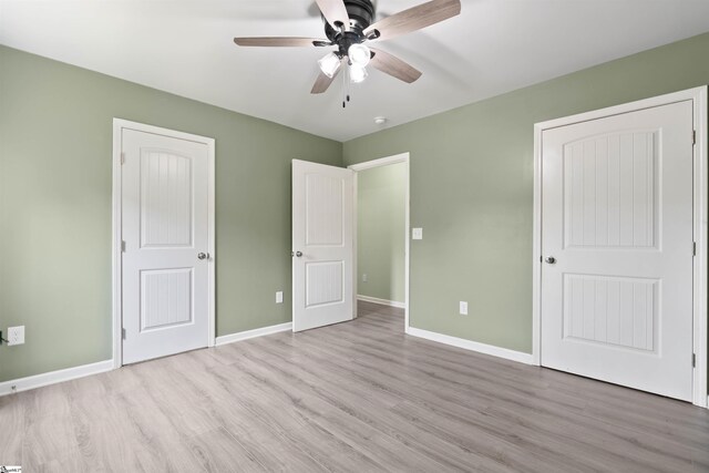 381 Deer Farm Pond Ln, Fair Play, SC 29643 - unfurnished bedroom featuring wood finished floors, baseboards, and ceiling fan