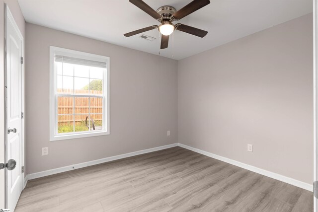 381 Deer Farm Pond Ln, Fair Play, SC 29643 - unfurnished room featuring light wood-type flooring, visible vents, a ceiling fan, and baseboards
