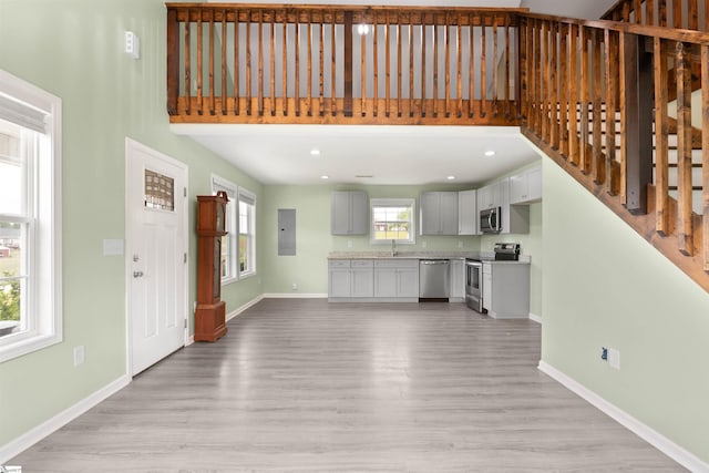 381 Deer Farm Pond Ln, Fair Play, SC 29643 - unfurnished living room with light wood-type flooring and baseboards