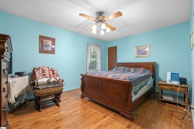 222 Mason Dr, Inman, SC 29349 - bedroom with light wood-type flooring, baseboards, and ceiling fan