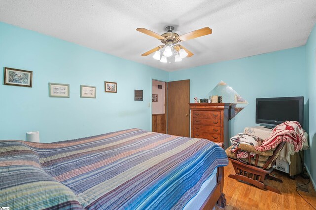 222 Mason Dr, Inman, SC 29349 - bedroom featuring a ceiling fan, wood finished floors, and a textured ceiling