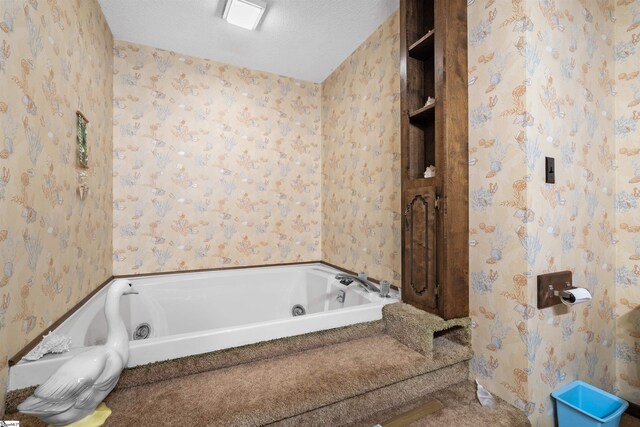 222 Mason Dr, Inman, SC 29349 - bathroom with a whirlpool tub, wallpapered walls, and a textured ceiling