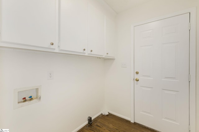 clothes washing area featuring dark wood finished floors, baseboards, cabinet space, and washer hookup