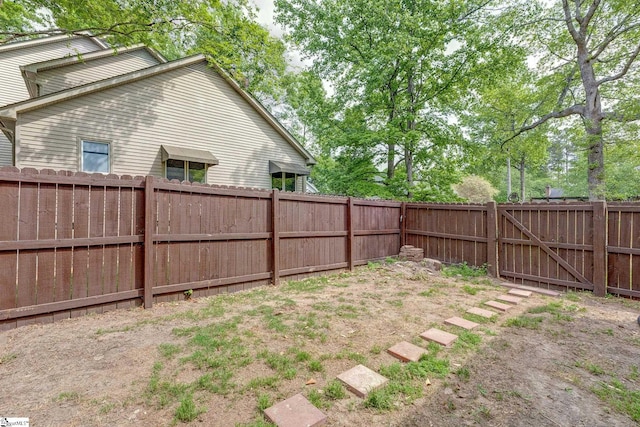 view of yard with a fenced backyard