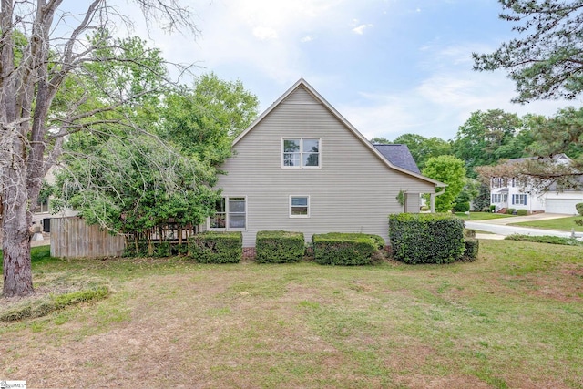 view of home's exterior featuring a lawn