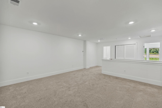 418 Palazzo Pl, Greer, SC 29650 - spare room with baseboards, visible vents, recessed lighting, and light colored carpet