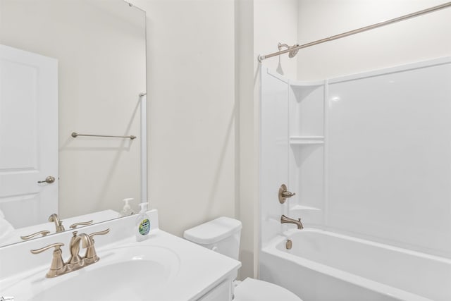 bathroom with toilet, vanity, and washtub / shower combination