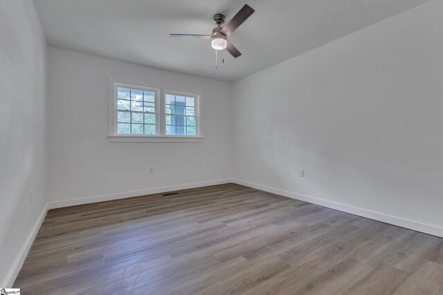 710 Druid Hills Dr, Anderson, SC 29621 - empty room with ceiling fan, baseboards, wood finished floors, and visible vents