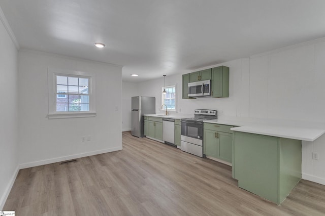 710 Druid Hills Dr, Anderson, SC 29621 - kitchen with green cabinetry, light countertops, appliances with stainless steel finishes, and light wood-style flooring