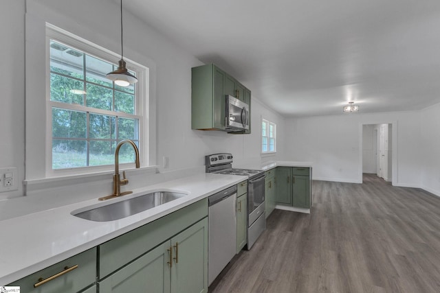 710 Druid Hills Dr, Anderson, SC 29621 - kitchen with dark wood-type flooring, green cabinetry, stainless steel appliances, and a sink