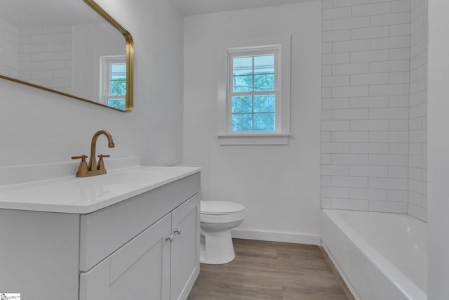 710 Druid Hills Dr, Anderson, SC 29621 - bathroom with baseboards, wood finished floors, toilet, and vanity