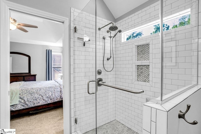 ensuite bathroom with lofted ceiling, a shower stall, ensuite bath, and a ceiling fan