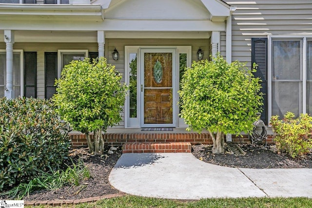 doorway to property with a porch