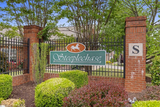community sign with fence