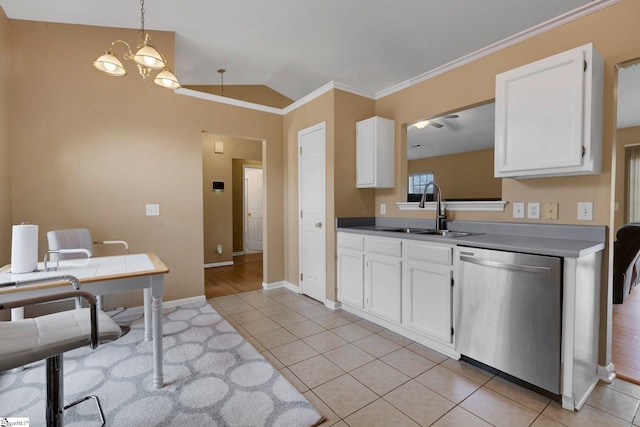 kitchen featuring white cabinets, dishwasher, light tile patterned floors, a sink, and crown molding