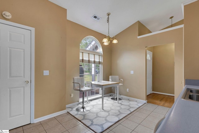 home office with light tile patterned flooring, an inviting chandelier, baseboards, lofted ceiling, and visible vents