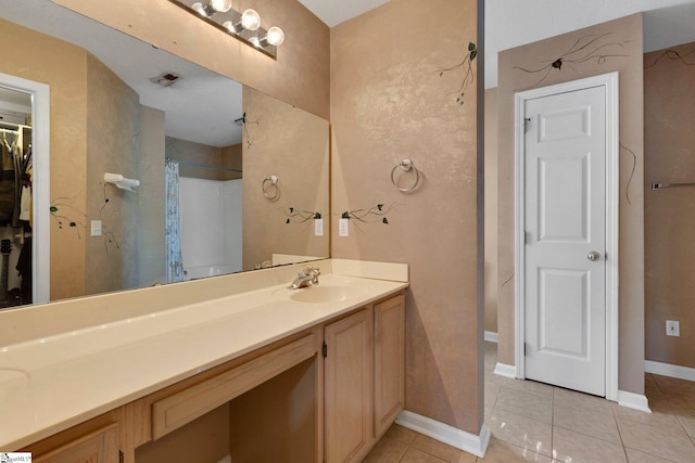 full bath featuring tile patterned floors, baseboards, vanity, and curtained shower