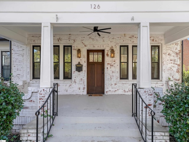 doorway to property with a porch and a ceiling fan