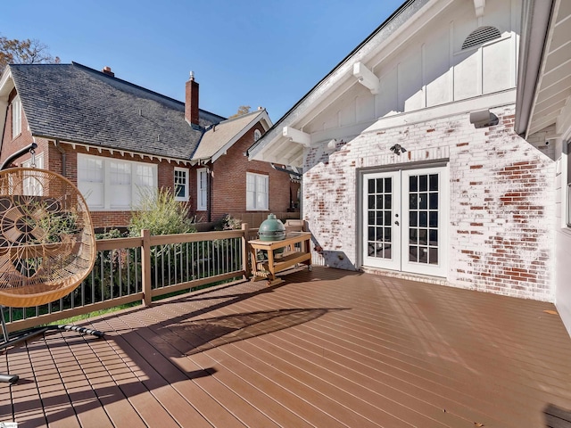 wooden deck featuring french doors