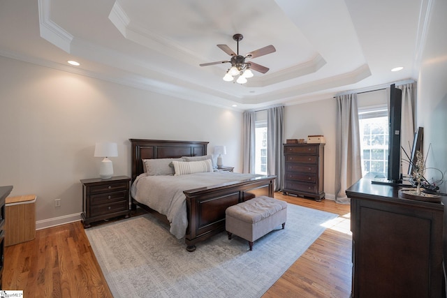 102 Rabon Chase Ct, Fountain Inn, SC 29644 - bedroom featuring a tray ceiling, light wood-style flooring, crown molding, and baseboards