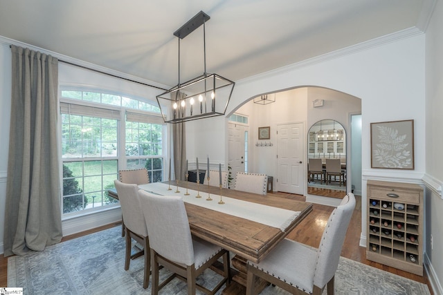 102 Rabon Chase Ct, Fountain Inn, SC 29644 - dining room with wood finished floors, arched walkways, a chandelier, and crown molding
