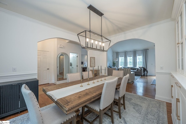102 Rabon Chase Ct, Fountain Inn, SC 29644 - dining room featuring an inviting chandelier, wood finished floors, arched walkways, and ornamental molding