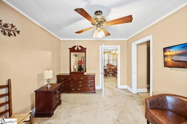 bedroom featuring ceiling fan with notable chandelier, baseboards, light carpet, and crown molding