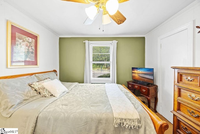 bedroom featuring ornamental molding and ceiling fan