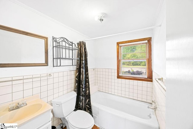 full bath with crown molding, toilet, tile walls, vanity, and wainscoting
