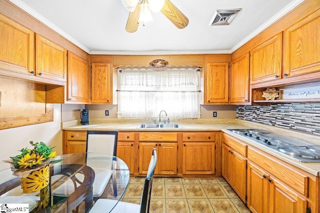 kitchen with visible vents, stainless steel electric cooktop, light countertops, and a sink