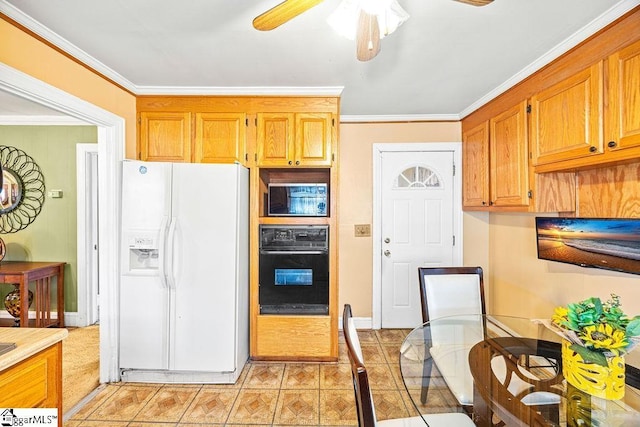 kitchen featuring white refrigerator with ice dispenser, black oven, ceiling fan, and ornamental molding