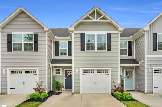 view of property featuring driveway and an attached garage