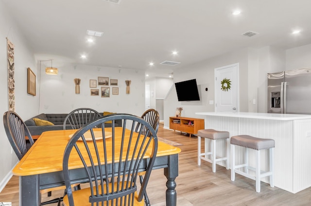 dining area featuring visible vents, recessed lighting, and light wood-style flooring